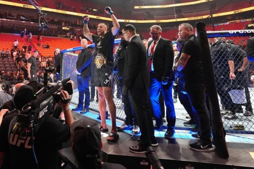 Carlos Ulberg, centre left, of New Zealand, celebrates after defeating Jiri Prochazka of Czechia by TKO to win their light heavyweight title bout at a UFC 327 mixed martial arts event on April 11, 2026, in Miami. (AP Photo/Rebecca Blackwell)