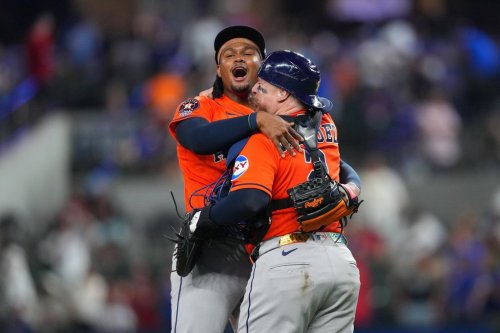 Houston Astros pitcher Alimber Santa, left, reacts with catcher Christian Vázquez after completing their team's combine no-hitter win over the Texas Rangers during a baseball game Monday, May 25, 2026, in Arlington, Texas. (AP Photo/Julio Cortez)