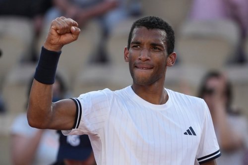 Felix Auger-Aliassime of Canada celebrates after winning the second-round men's singles tennis match against Roman Andres Burruchaga of Argentina at the French Open tennis tournament in Paris, Thursday, May 28, 2026. (AP Photo/Thibault Camus)