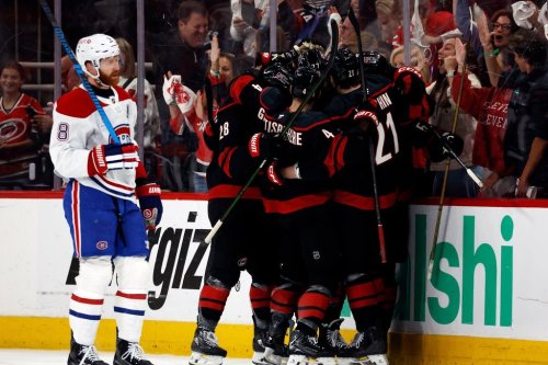 Carolina Hurricanes players celebrate after a goal by Eric Robinson as Montreal Canadiens' Mike Matheson (8) skates by during the first period in Game 5 of the Eastern Conference finals NHL hockey Stanley Cup playoff series in Raleigh, N.C., Friday, May 29, 2026. (AP Photo/Karl DeBlaker)