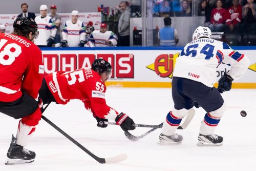 Canada's Mark Scheifele, centre, scores a goal during the 2026 IIHF Men's Ice Hockey World Championship preliminary round group B game between Canada and Norway, in Fribourg, Switzerland, Thursday, May 21, 2026. (Anthony Anex/Keystone via AP)
