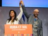 Quebec Solidaire co-spokesperson Ruba Ghazal, left, lifts Sol Zanetti’s arm as a symbol of victory after Zanetti was voted as new co-spokesperson in Quebec City, on Saturday, Nov. 8, 2025. THE CANADIAN PRESS/Karoline Boucher