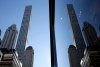 A building at 432 Park Avenue is reflected in another skyscraper in Manhattan, New York, Thursday, Feb. 18, 2016. (AP Photo/Seth Wenig)