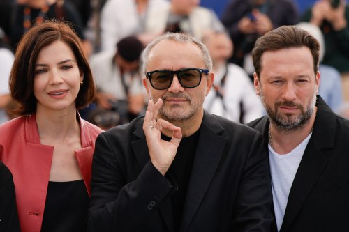 Iris Lebedeva, director Andrey Zvyagintsev and Dmitriy Mazurov pose for photographers at the photo call for the film Minotaur' at the 79th international film festival, Cannes, southern France, Wednesday, May 20, 2026. (Photo by Millie Turner/Invision/AP)