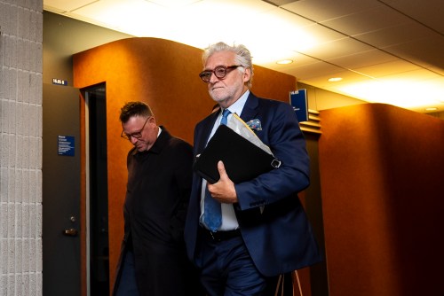 Just for Laughs founder Gilbert Rozon, right, leaves the courtroom for a break during his civil trial in Montreal on Monday, Sept. 22, 2025. THE CANADIAN PRESS/Christopher Katsarov
