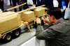 A vendor makes a repair to a model of a Hanwha K9MH mobile howitzer at the Canadian Association of Defence and Security Industries annual defence industry trade show CANSEC, in Ottawa, on Wednesday, May 28, 2025. THE CANADIAN PRESS/Justin Tang