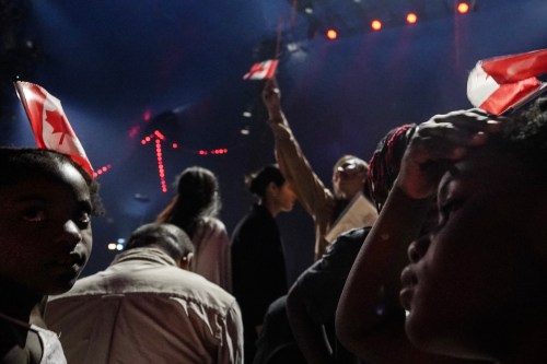 Nearly 400 new Canadians from 65 countries gather at a ceremony in Toronto to take an oath of citizenship on Friday, July 19, 2024. THE CANADIAN PRESS/Chris Young