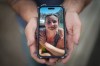 Jason Gaudreault, whose partner Tatjana Stefanski was found dead on April 14, 2024, after disappearing a day earlier, shows a photograph of her on his phone, in Lumby, B.C., on Monday, May 13, 2024. THE CANADIAN PRESS/Darryl Dyck