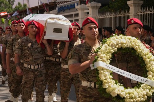 Army soldiers carry the coffin of Brig. Gen. Wissam Sabra, who was killed Saturday in south Lebanon along with a captain and a soldier in an Israeli airstrike, during his funeral procession in Beirut, Sunday, June 7, 2026. (AP Photo/Hassan Ammar)