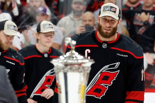 Carolina Hurricanes' Jordan Staal (11) skates to accept the Prince of Wales Trophy following Game 5 of the Eastern Conference finals NHL hockey Stanley Cup playoff series against the Montreal Canadiens in Raleigh, N.C., Friday, May 29, 2026. (AP Photo/Karl DeBlaker)