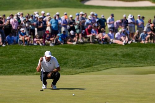 Scottie Scheffler lines up his shot on the 10th green during the third round of the PGA Championship golf tournament at Aronimink Golf Club, Saturday, May 16, 2026, in Newtown Square, PA. (AP Photo/Matt Slocum)