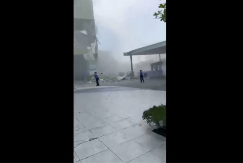 This image from a video shows dust and debris outside a building after a powerful earthquake in General Santos city on the island of Mindanao, Philippines Monday, June 8, 2026. (Ernesto Torres Jr via AP)