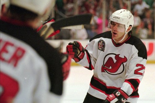 FILE — New Jersey Devils Claude Lemieux is greeted at the bench after scoring a goal in the first period of Game 3 of the NHL Stanley Cup Finals against the Detroit Redwings Thursday, June 22, 1995 at the Meadowlands in East Rutherford, N.J. (AP Photo/Bill Kostroun, File)