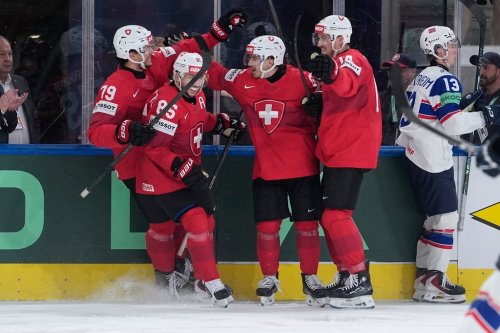Switzerland's Ken Jager (62) celebrates after scoring his side's second goal during the 2026 IIHF Men's Ice Hockey World Championship semifinal match between Switzerland and Norway, in Zurich, Switzerland, Saturday, May 30, 2026, (AP Photo/Darko Bandic)