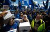 Supporters carry boxes of signatures to submit for a separation referendum to Elections Alberta in Edmonton, on Monday, May 4, 2026. THE CANADIAN PRESS/Jason Franson