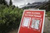 A closed sign blocks the trail to Bow Glacier Falls north of Lake Louise, Alta., in Banff National Park on Friday, June 20, 2025. THE CANADIAN PRESS/Jeff McIntosh