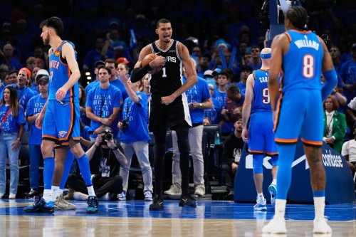 San Antonio Spurs forward Victor Wembanyama (1) celebrates after a dunk during the second overtime of Game 1 in a third-round NBA basketball playoffs series against the Oklahoma City Thunder Monday, May 18, 2026, in Oklahoma City. (AP Photo/Tony Gutierrez)