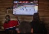 Residents watch Game 4 of second round NHL playoff hockey between the Montreal Canadiens and Buffalo Sabres at the Old Brewery Mission homelessness resource centre in Montreal on Tuesday, May 12, 2026. THE CANADIAN PRESS/Peter McCabe