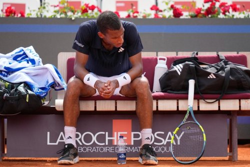 Canada's Felix Auger Aliassime sits as he reacts during the match against Argentina's Mariano Navone at the Italian Open tennis tournament in Rome, Saturday, May 9, 2026. (AP Photo/Alessandra Tarantino)