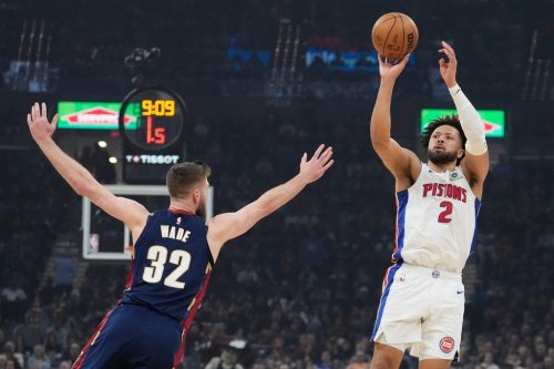 Detroit Pistons' Cade Cunningham (2) shoots over Cleveland Cavaliers' Dean Wade (32) in the first half of Game 6 of a second-round NBA basketball playoffs series Friday, May 15, 2026, in Cleveland. (AP Photo/Sue Ogrocki)