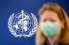 A person is wearing a protective face mask in front of the WHO logo, during the media regarding the epidemic of Ebola disease, during a press conference at the World Health Organization (WHO) headquarters in Geneva, Switzerland, Friday, May 22, 2026. (Martial Trezzini/Keystone via AP)