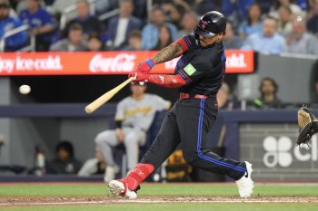 Blue Jays outfielder Yohendrick Pinango hits a two-run double off Pittsburgh Pirates pitcher Bubba Chandler during a Major League Baseball game in Toronto on May 22, 2026. THE CANADIAN PRESS/Chris Young