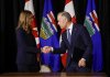 Prime Minister Mark Carney participates in a signing ceremony with Alberta Premier Danielle Smith in Calgary, Alta., Friday, May 15, 2026. THE CANADIAN PRESS/Jeff McIntosh