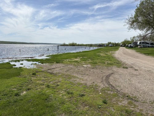 A row of electrical hookups for campsites stands in water on the edge of Lake of the Prairies on Friday. (Supplied)