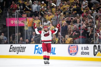 Carolina Hurricanes center Jordan Staal celebrates an empty-net goal by left wing Nikolaj Ehlers during the third period in Game 4 of the NHL hockey Stanley Cup Final series against the Vegas Golden Knights, Tuesday, June 9, 2026, in Las Vegas. (AP Photo/John Locher)