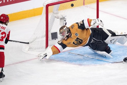 Carolina Hurricanes right wing Jackson Blake, left, scores on Vegas Golden Knights goaltender Carter Hart during the first period in Game 4 of the NHL hockey Stanley Cup Final series Tuesday, June 9, 2026, in Las Vegas. (AP Photo/Candice Ward)
