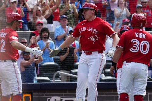 Toronto Blue Jays' Ernie Clement, left, and Alejandro Kirk congratulates Sean Keys after he hit a three run home run against the New York Mets during third inning MLB baseball action in Toronto on Wednesday, July 1, 2026. THE CANADIAN PRESS/Frank Gunn