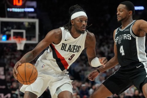 FILE - Portland Trail Blazers forward Jerami Grant (9) drives against San Antonio Spurs guard De'aaron Fox (4) during the second half in Game 3 of a first-round NBA playoffs basketball series in Portland, Ore, April 24, 2026. (AP Photo/Jenny Kane, File)