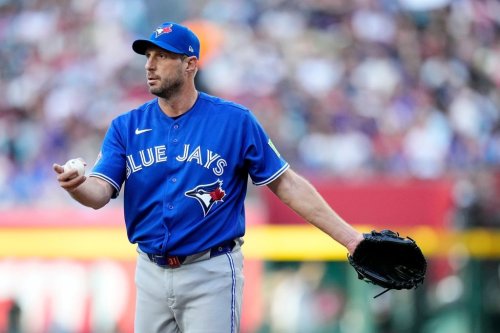 Toronto Blue Jays starting pitcher Max Scherzer pauses on the field during the first inning of a baseball game against the Arizona Diamondbacks, Saturday, April 18, 2026, in Phoenix. (AP Photo/Ross D. Franklin)
