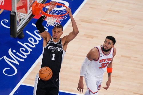 San Antonio Spurs forward Victor Wembanyama (1) dunks as New York Knicks center Karl-Anthony Towns (32) looks on during the second half of Game 3 of the NBA Finals basketball series, Monday, June 8, 2026, in New York. (AP Photo/Yuki Iwamura)