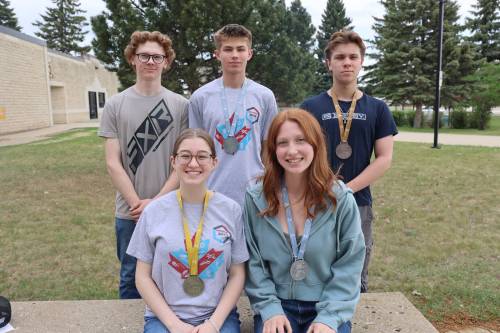 Crocus Plains Regional Secondary School students Kayla DeCosse (front left), Nia Smith (front right), Parker Martin (back right) and Cody Johnson (centre) were recently awarded medals in the Skills Canada competition in Toronto. Landon Klassen (back left) finished fourth nationally in outdoor power and recreation. (Abiola Odutola/The Brandon Sun)