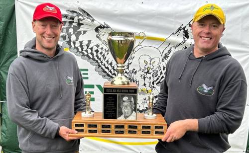Darcy Howarth, right, accepts the Grey Owl golf tournament trophy from president Tyler Thompson last June. The MacGregor native is back to defend his title starting on Friday. (Supplied)