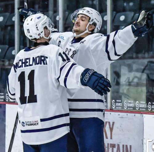 Dauphin Kings forward Sheldon Shyiak winds up for a big hug with teammate Ash Mitchelmore after a Manitoba Junior Hockey League win this season. (Submitted)