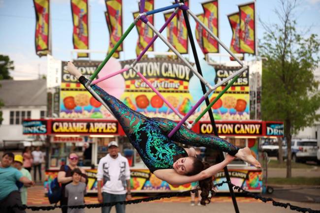 Kris Mac with Elevation Entertainment performs an aerial cube routine for fairgoers on the opening day of the Manitoba Summer Fair at the Keystone Centre grounds on Wednesday. The fair runs until Sunday. (Tim Smith/The Brandon Sun)