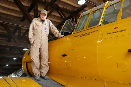 Commonwealth Air Training Plan Museum chief pilot Jeff Bell stands with one of the organization&rsquo;s heritage aircrafts on Thursday. The museum plans to run membership flights this Sunday as part of Armed Forces Day. (Jae Murray/The Brandon Sun)