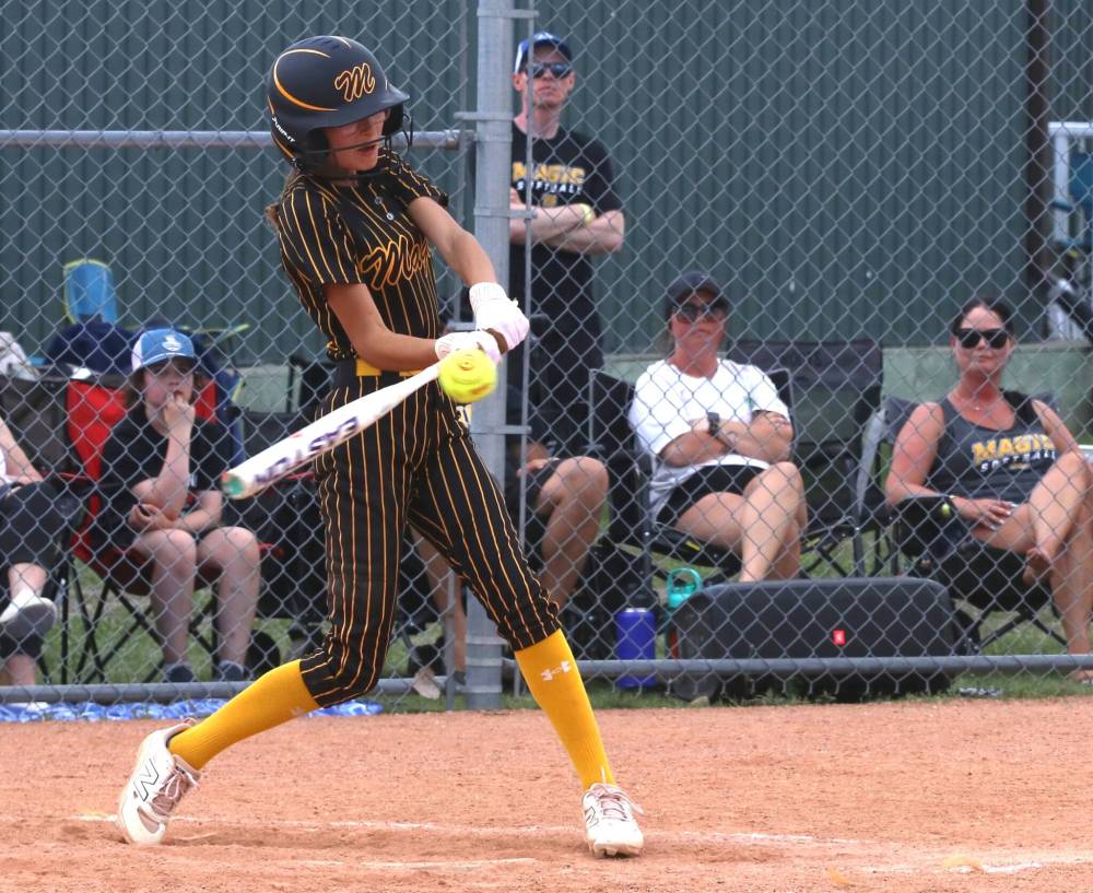 Westman Magic batter Emerson Anderson gets the bat on the ball during the under-13 final against the Saskatoon Raiders at the Wheat City Classic at the Ashley Neufeld Softball Complex on Sunday. They are the first Magic team to win their event at the third-year tournament. (Perry Bergson/The Brandon Sun) June 14, 2026