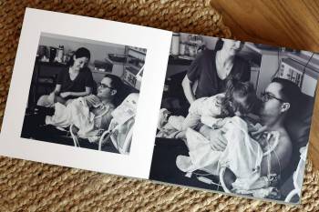 Photos in an album show Emma and Colton Spraggs and their daughter Robyn with their son Jayce, at the Neonatal Intensive Care Unit at St. Boniface Hospital in Winnipeg. (Tim Smith/The Brandon Sun)