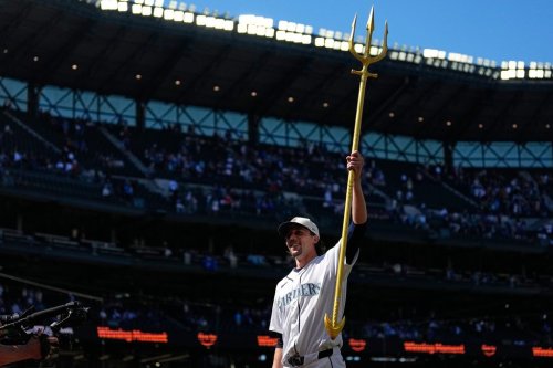 Seattle Mariners starting pitcher Logan Gilbert lifts the trident to celebrate a win over the Toronto Blue Jays in a baseball game, Saturday, July 4, 2026, in Seattle. (AP Photo/Lindsey Wasson)