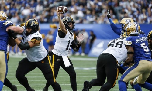 Hamilton Tiger-Cats quarterback Bo Levi Mitchell (19) throws to Kiondre Smith (85) for the touchdown against the Winnipeg Blue Bombers during first half CFL football action in Winnipeg on Thursday, June 11, 2026. THE CANADIAN PRESS/John Woods