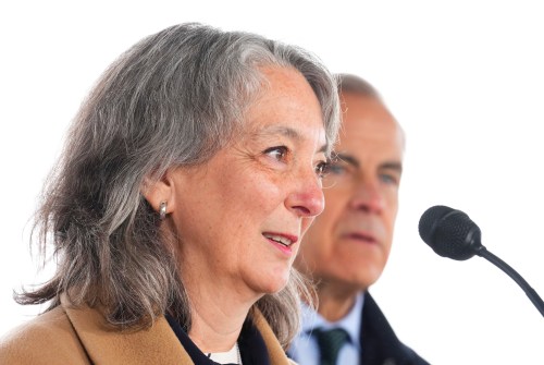 Environment and Climate Change Minister Julie Dabrusin,left, and Prime Minister Mark Carney take part in an announcement in Wakefield, Que., Tuesday, March 31, 2026. THE CANADIAN PRESS/Sean Kilpatrick