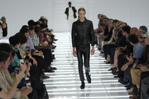 A model wears a creation from Prada's Spring/Summer 2027 men's collection presented in Milan, Italy, Sunday, June 21, 2026. (AP Photo/Luca Bruno)
