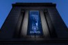 FILE - A banner with a portrait of President Donald Trump is hung from the Department of Justice, March 7, 2026, in Washington. (AP Photo/Jose Luis Magana)