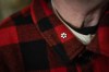 The Order of Canada pin is seen on the lapel of Canadian journalist and musician Nardwuar the Human Serviette at Neptune Records in Vancouver on Monday, Dec. 29, 2025. THE CANADIAN PRESS/Ethan Cairns