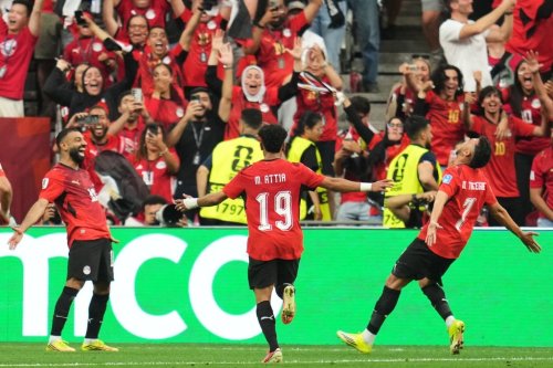 Egypt's Trezeguet (7) celebrates with Mohamed Salah (10) and Marawan Attia (19) after scoring his side's third goal during the World Cup Group G soccer match between New Zealand and Egypt in Vancouver, British Columbia, Sunday, June 21, 2026. (AP Photo/Abbie Parr)