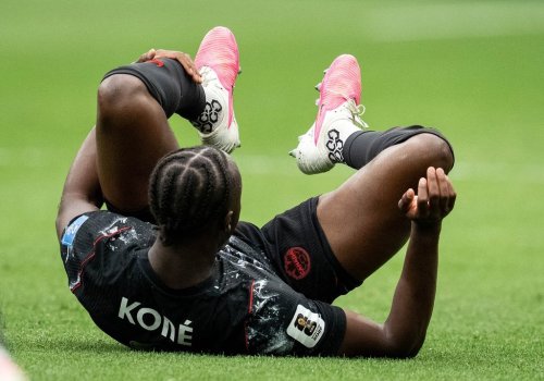 Canada's Ismael Kone rolls on the pitch after suffering a lower body injury during the second half of a World Cup Group B soccer match against Qatar, in Vancouver, on Thursday, June 18, 2026. THE CANADIAN PRESS/Ethan Cairns