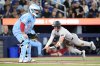 New York Yankees left-fielder Max Schuemann scores in front of Blue Jays catcher Alejandro Kirk in Toronto on Sunday June 14, 2026. THE CANADIAN PRESS/Chris Young